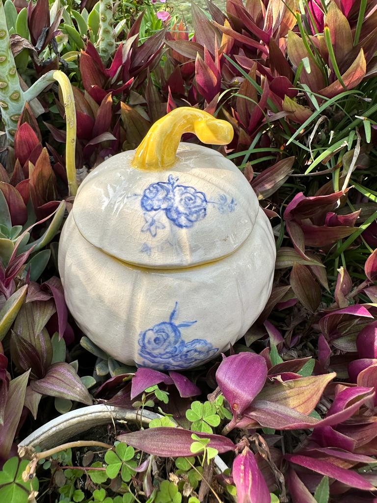 White with blue roses and yellow lid