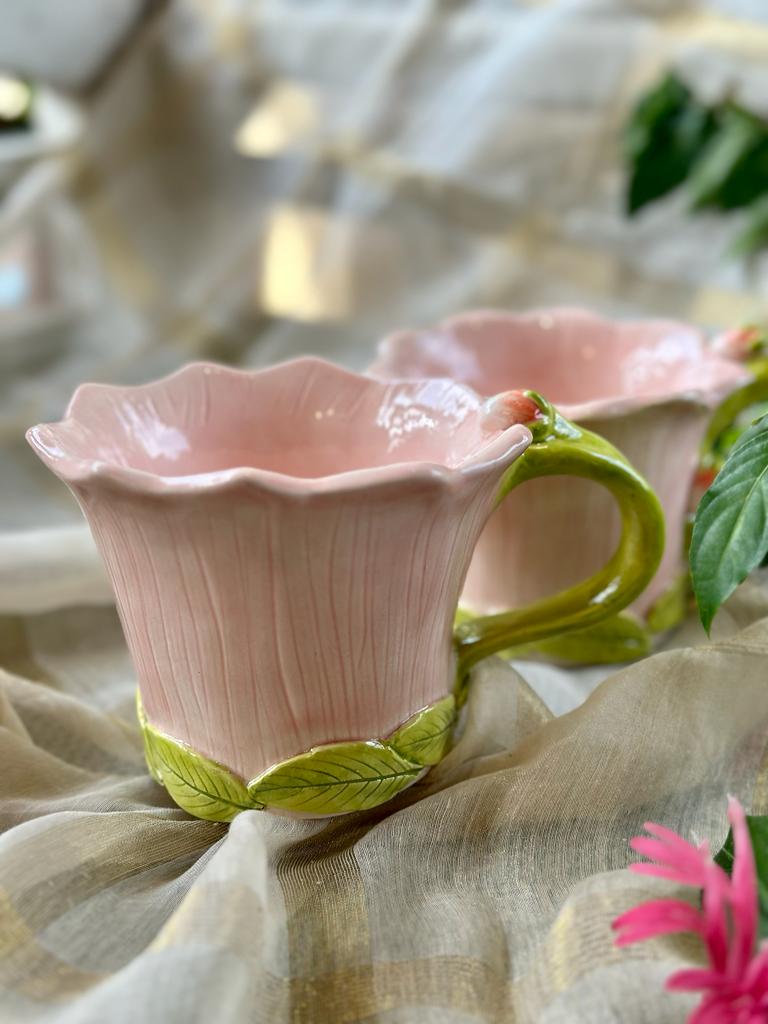 Pink cup with green leaves
