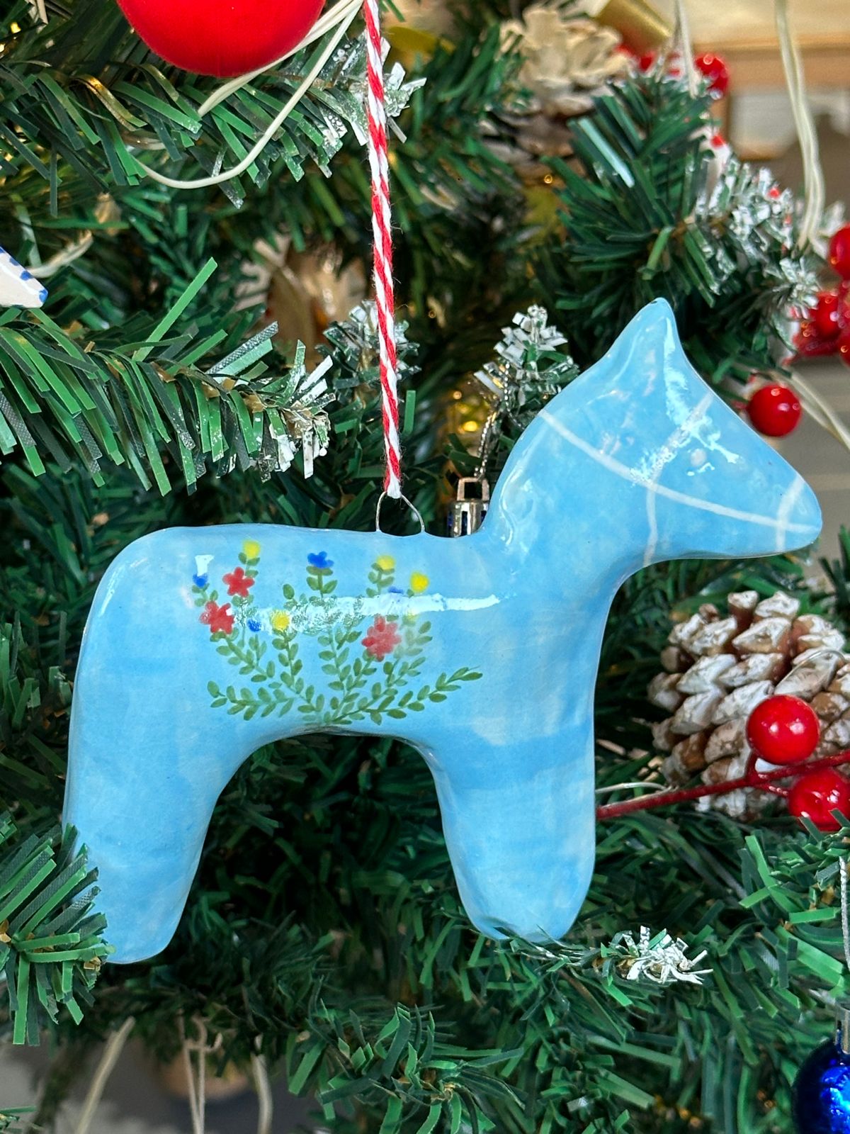 Blue horse hanging