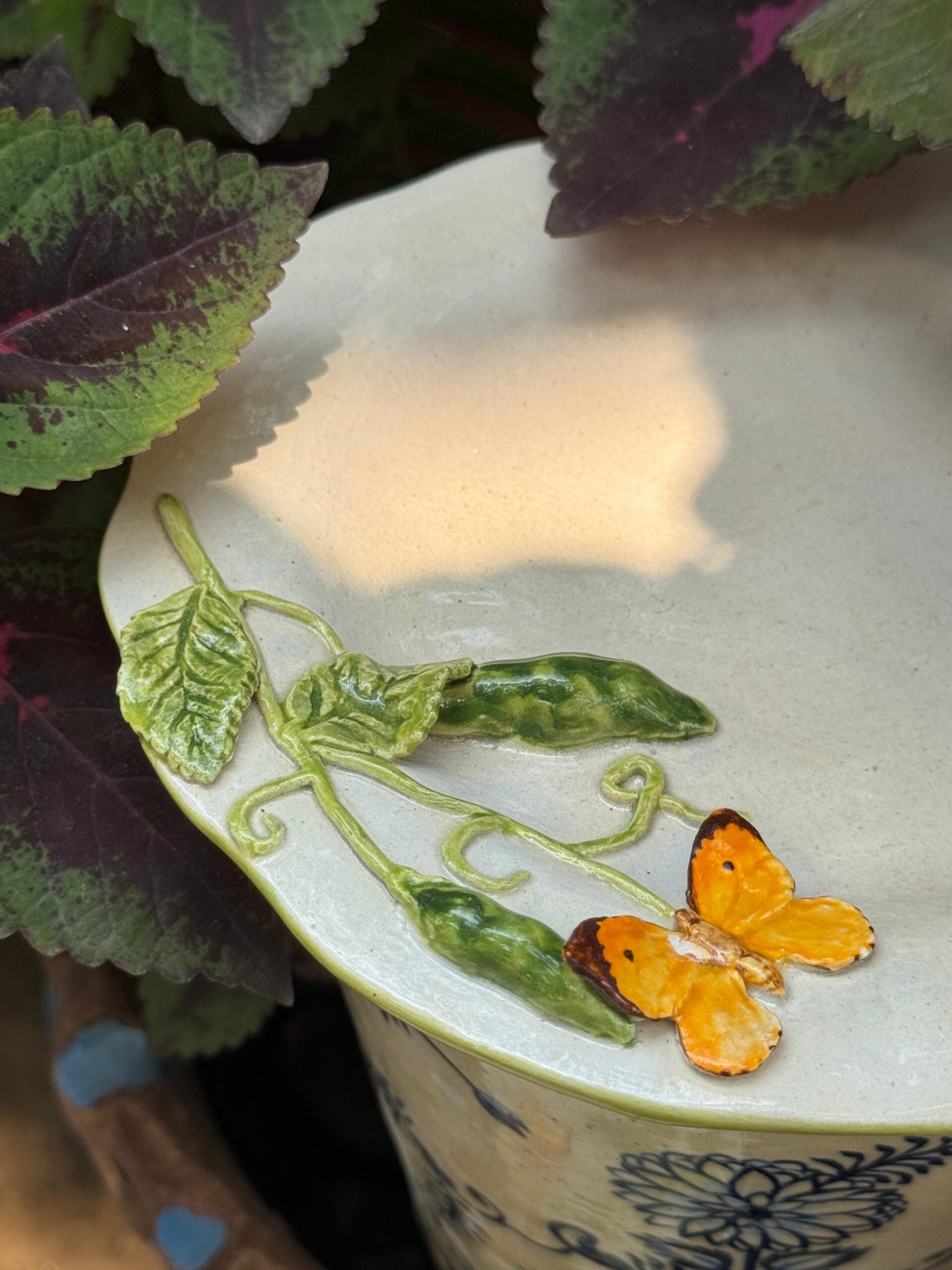 Peas with orange butterfly plate